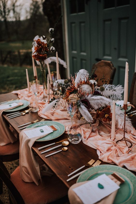 table with flowers, napkins and candles