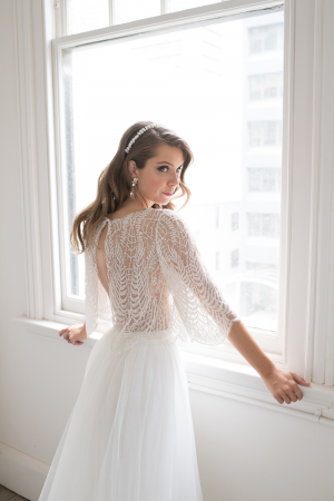 Bride standing at window