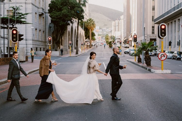 bride and groom walking in the city